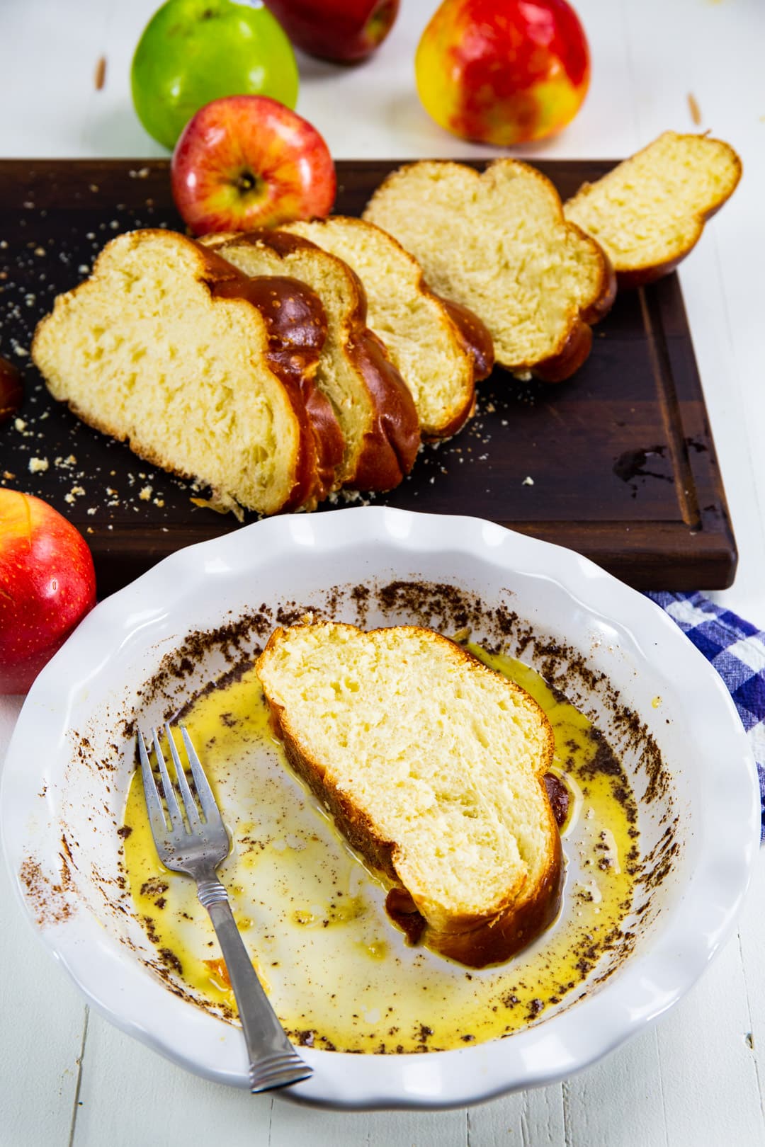 Bread getting dipped in egg mixture.