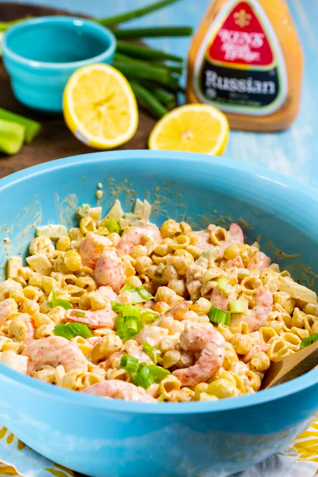 Tangy Shrimp Pasta Salad in blue mixing bowl.