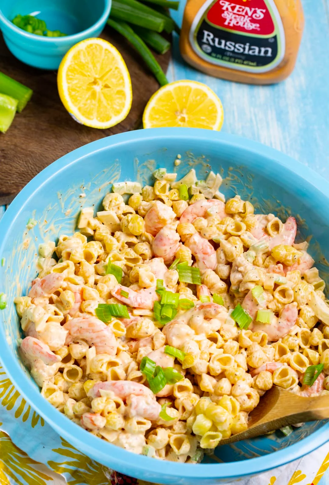Shrimp salad in a bowl and fresh lemons.