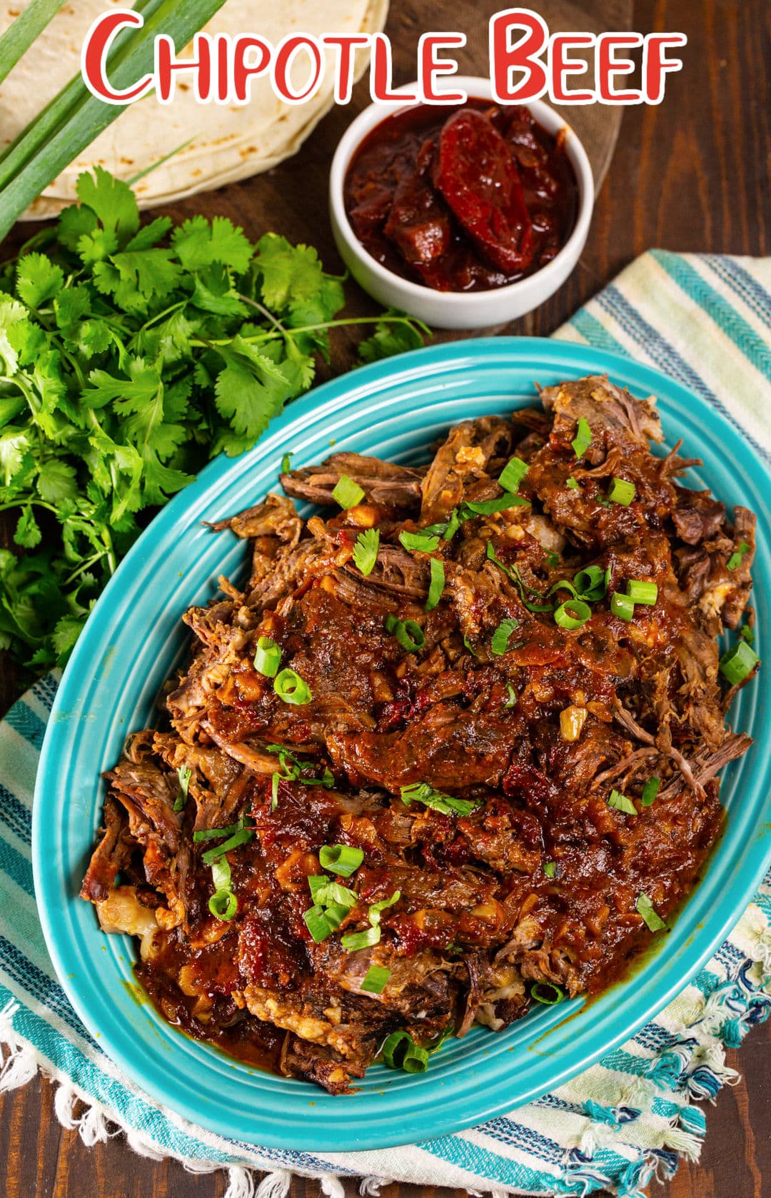 Chipotle Beef on a serving plate and bowl of chipotle peppers.