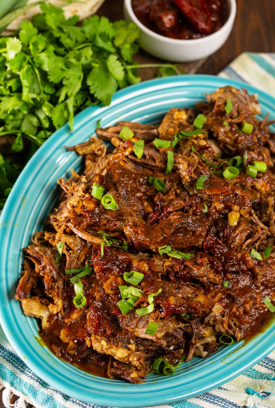 Chipotle Beef on a blue serving plate.
