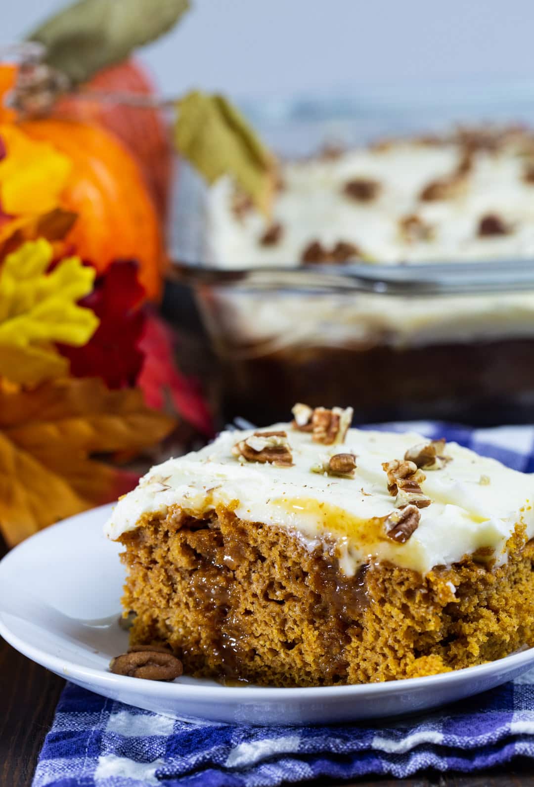 Piece of Pumpkin Caramel Poke Cake on a plate.