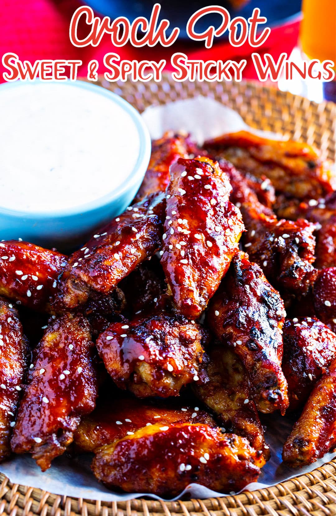 Crock Pot Sweet and Spicy Sticky Wings sprinkled with sesame seeds.