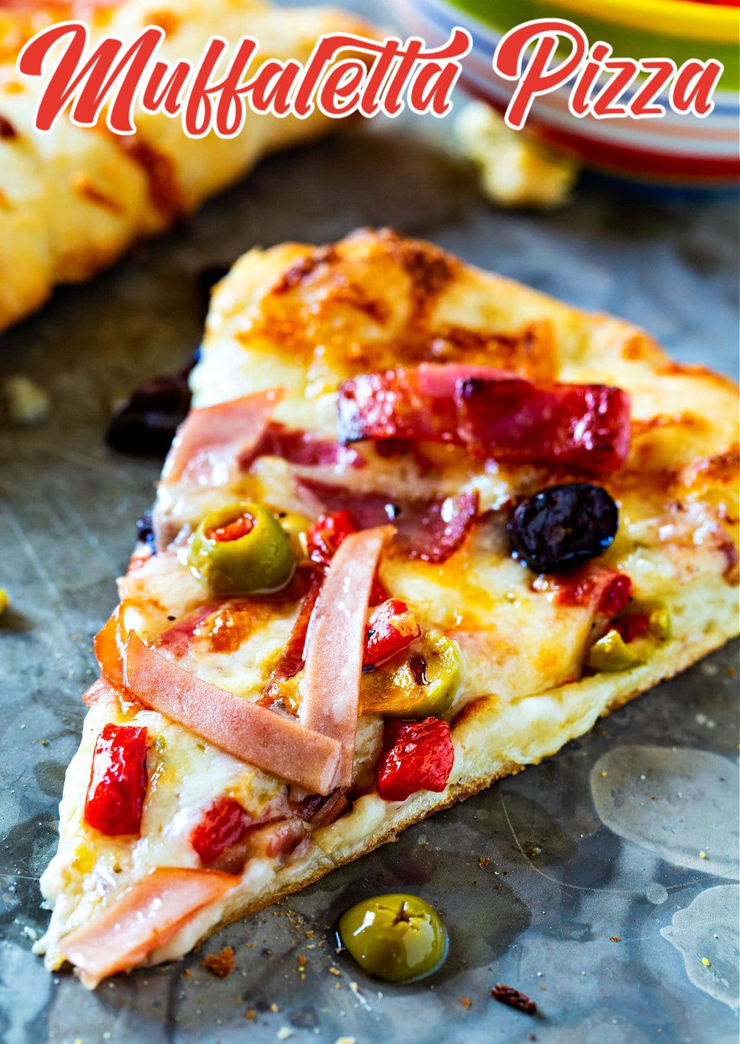 Slice of Muffaletta Pizza.