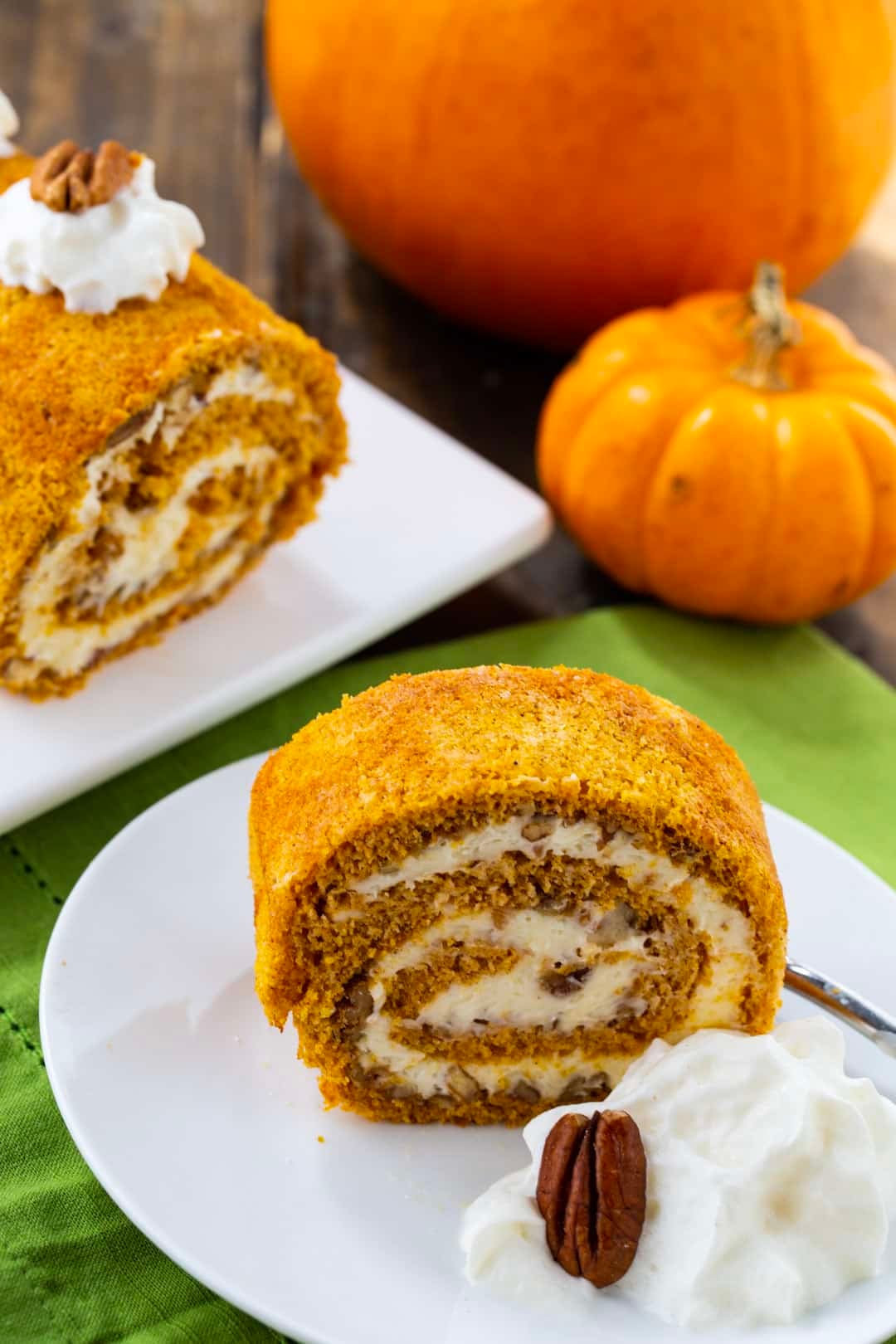 Slice of Pumpkin Cake Roll on a plate.
