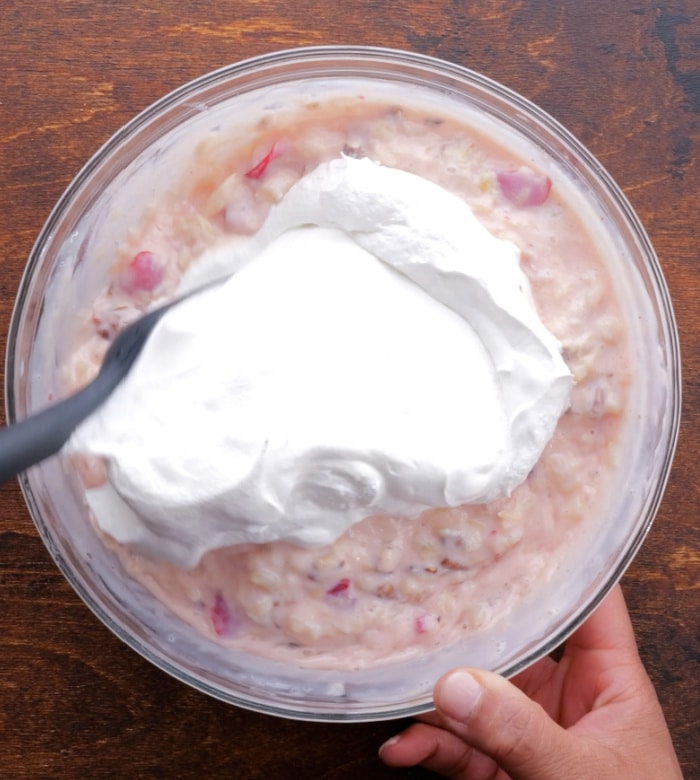 Adding Cool Whip to filling.