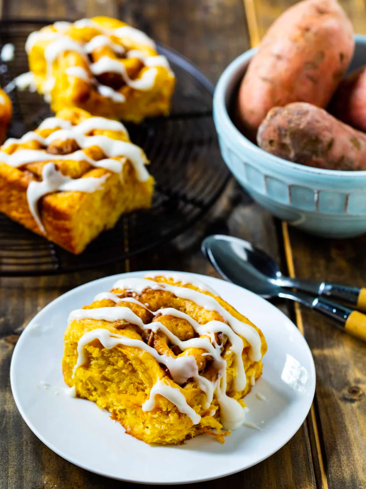 Sweet Potato Cinnamon Rolls and bowl full of sweet potatoes.
