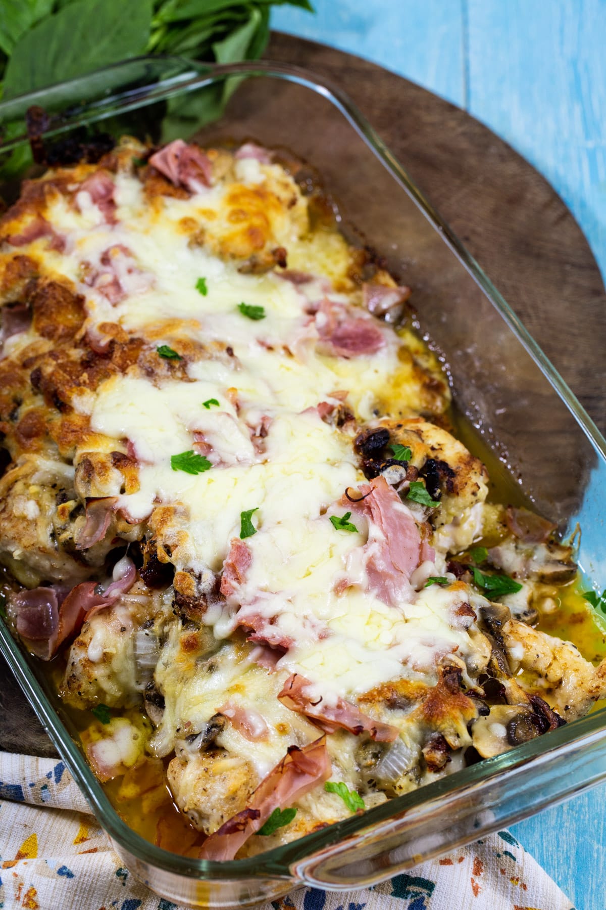 Company Chicken topped with ham, mushrooms and cheese.