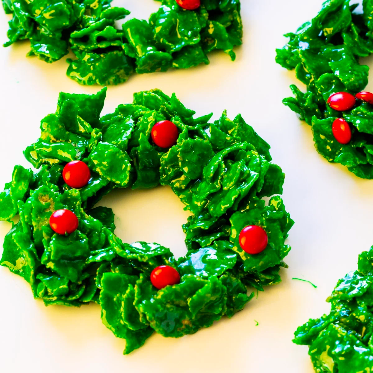Cornflake Christmas Wreaths spread out on white background.