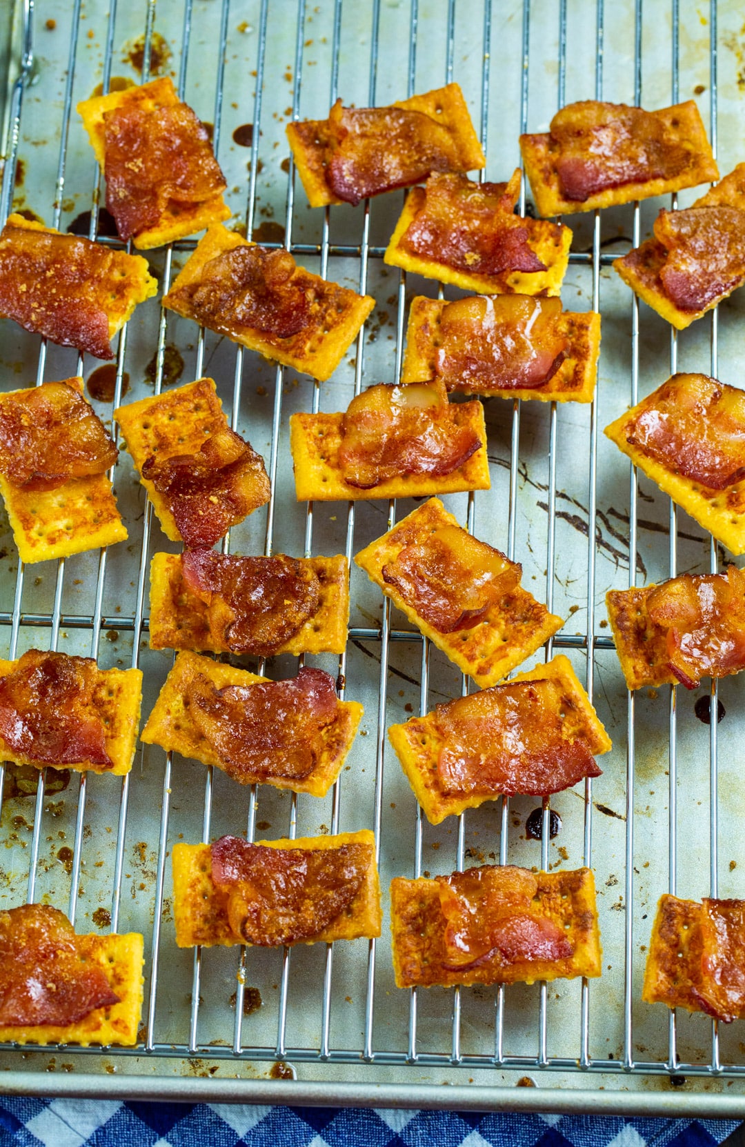 Spicy Candied Bacon Crackers on wire rack.