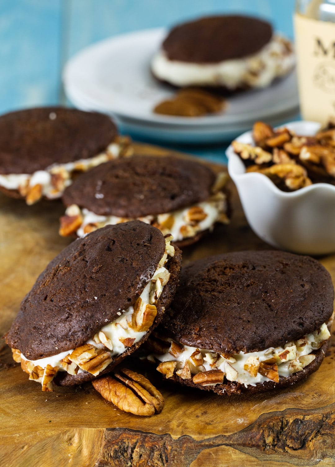 Whiskey Whoopie Pies on wooden cutting board.