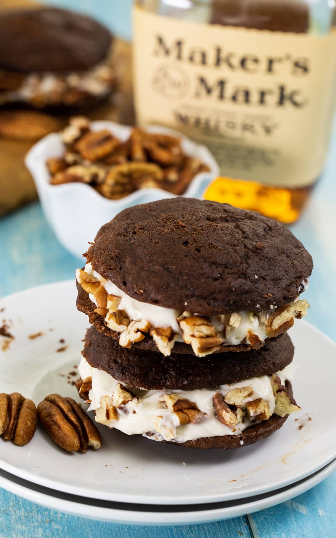 Two cream filled cookies stacked on top of each other.