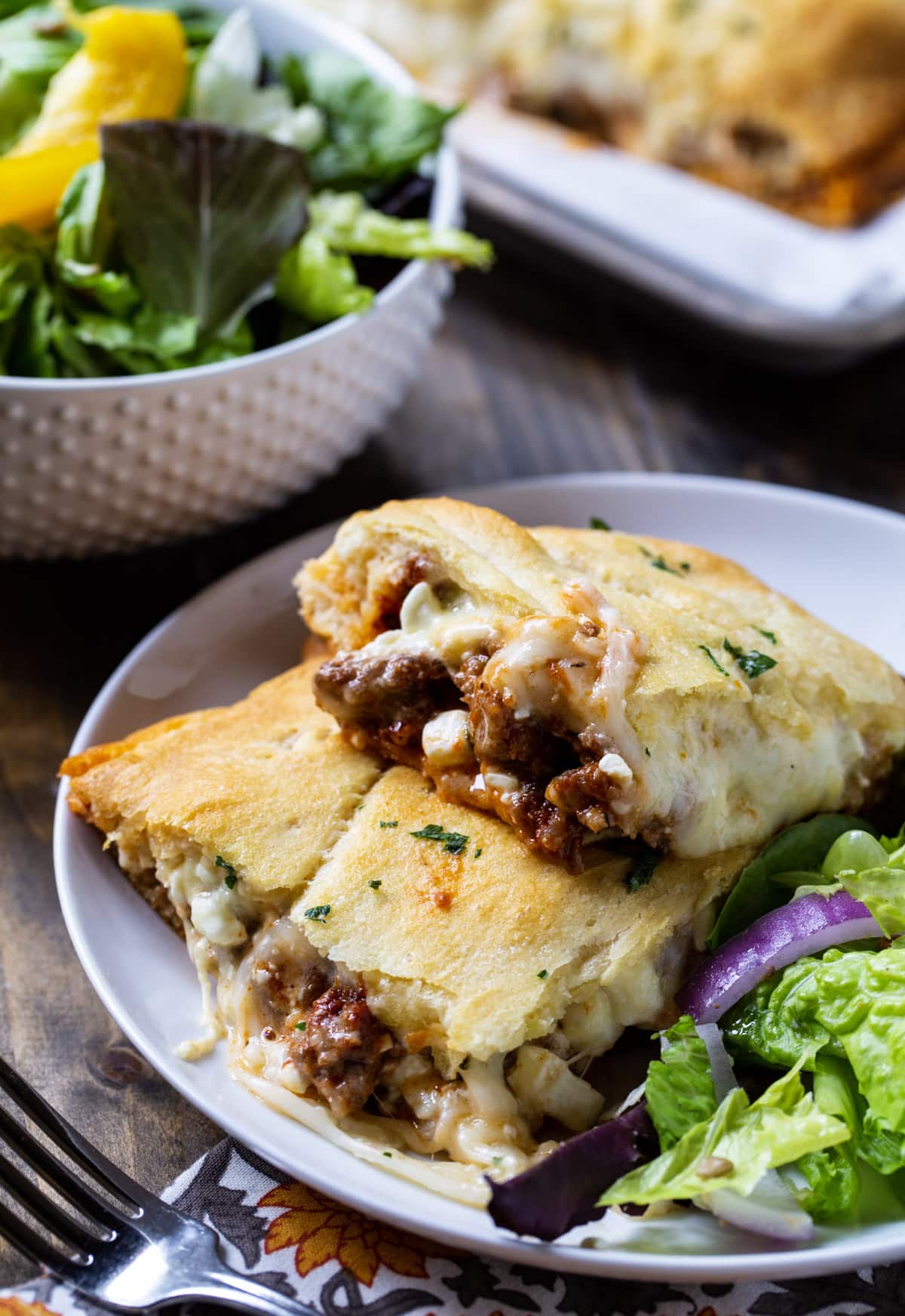 Crescent Lasagna on plate with salad.
