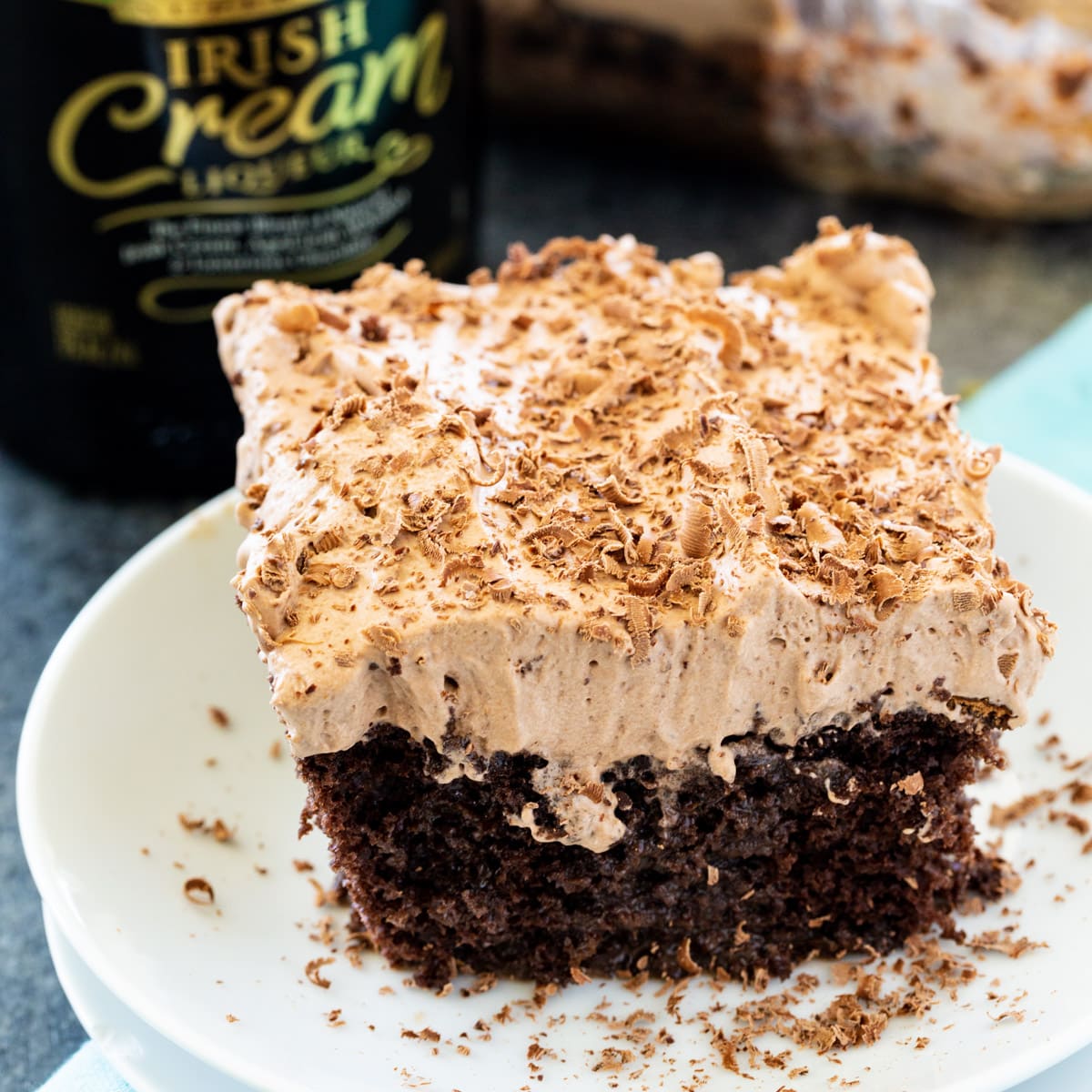 Piece of Irish Cream Poke Cake on a plate.