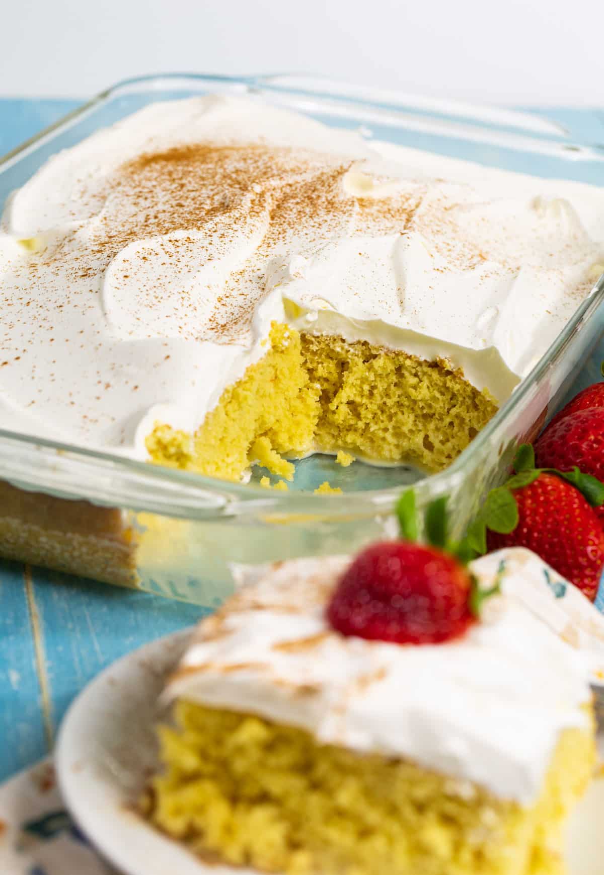 Tres LEches Cake with slice cut away.