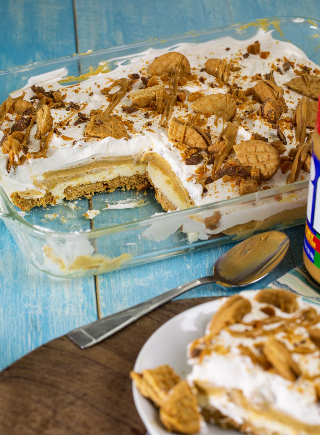 Peanut Butter Lasagna in pan with a piece cut away.
