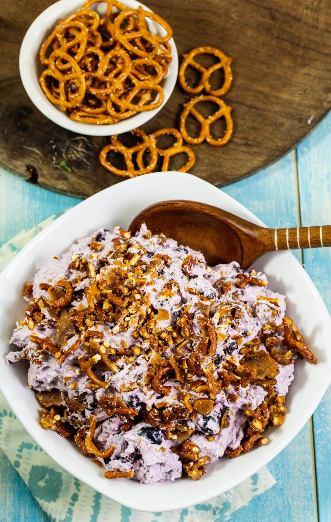 Pretzel Fluff with Blueberries and pretzels in a small bowl.