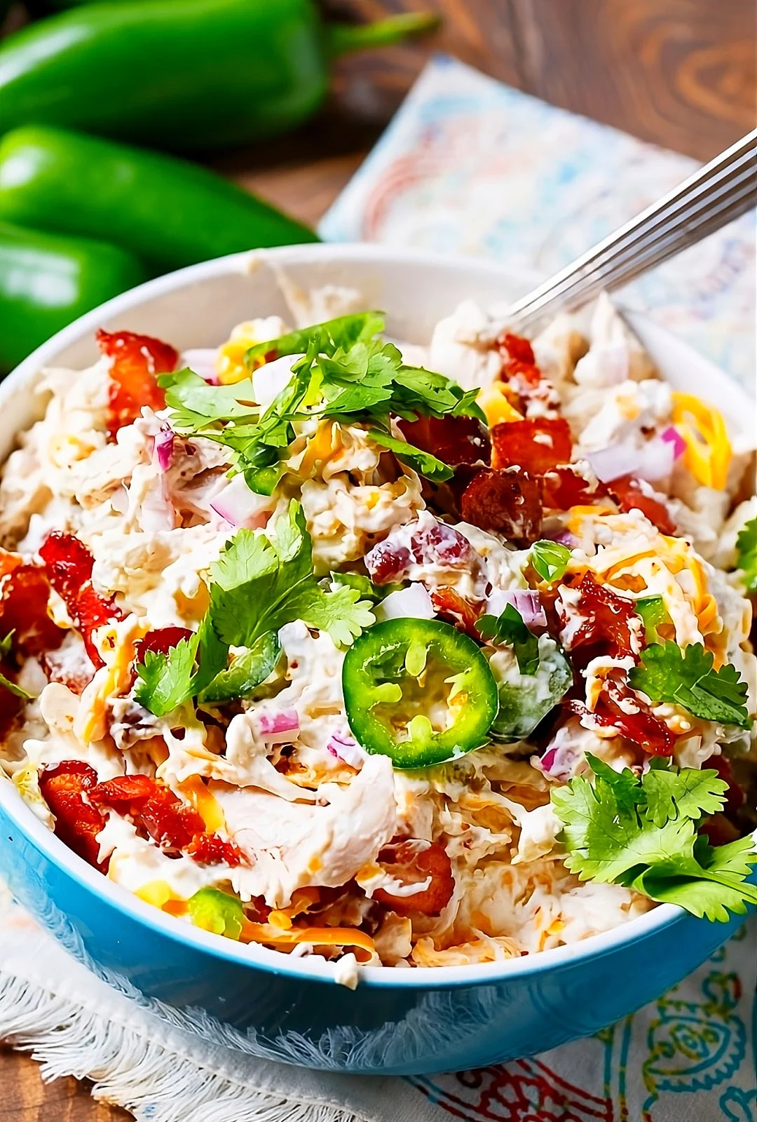Chicken Salad topped with cilantro in a serving bowl.