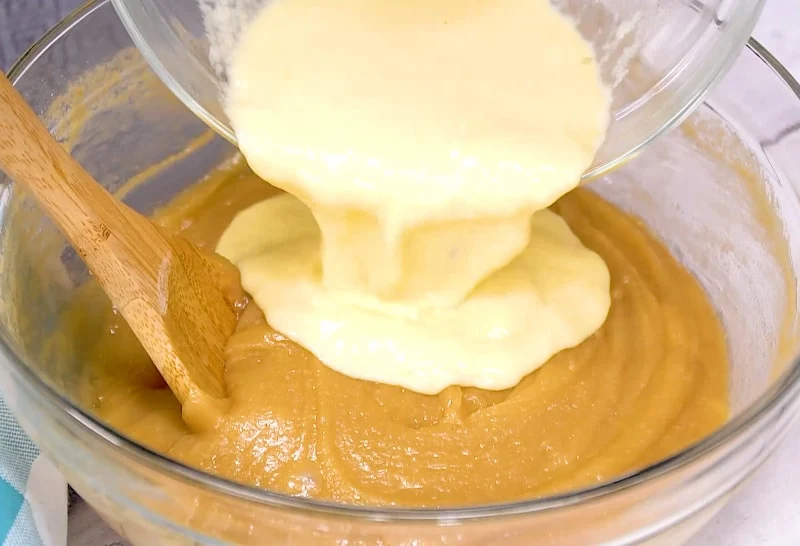 Wet ingredients being added to batter.