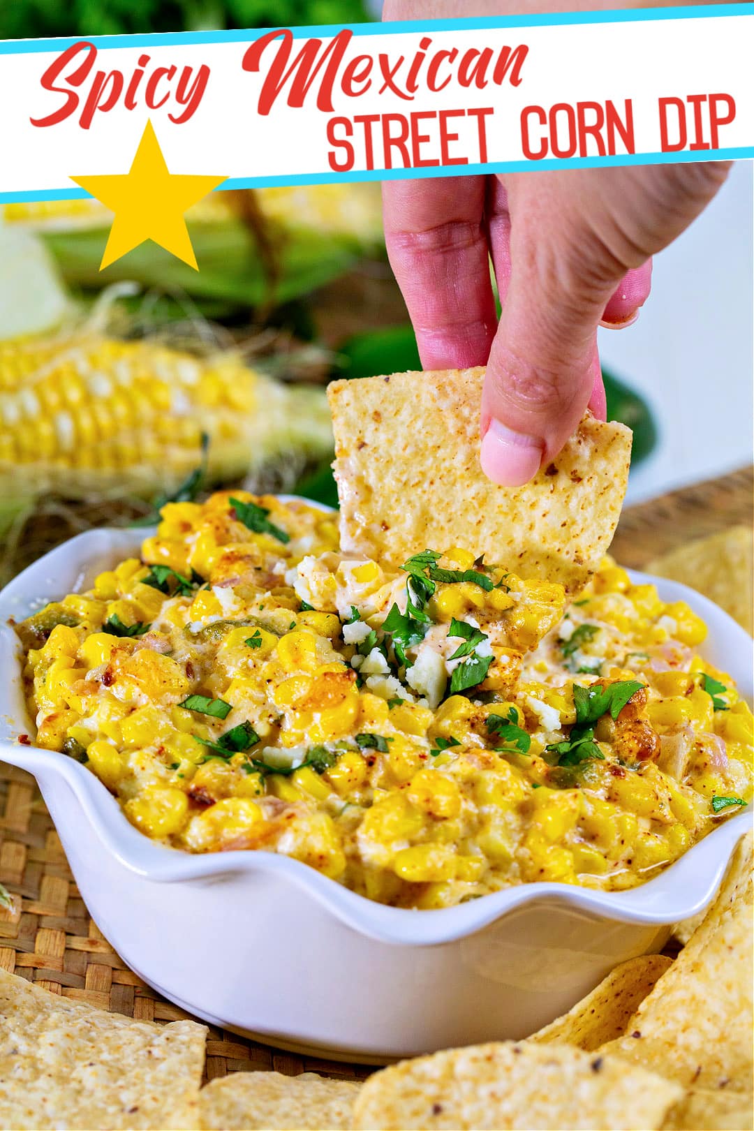Chip getting dipped into corn dip.
