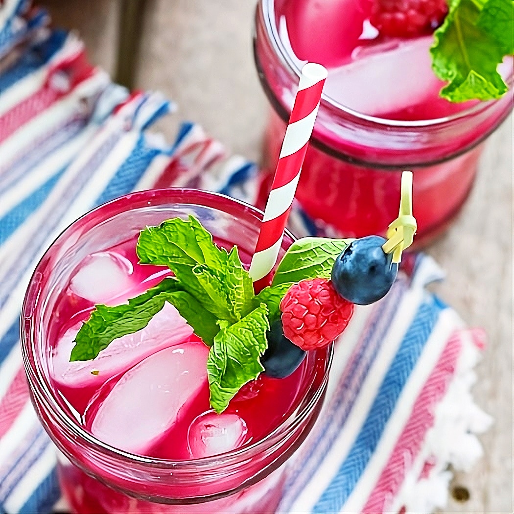 Mojitos in glasses with fresh mint.