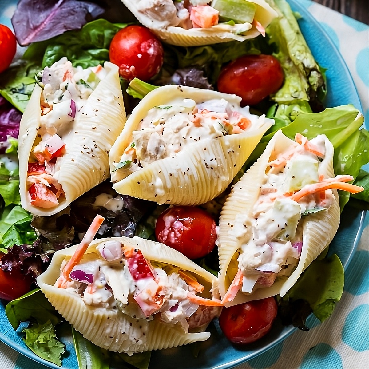 Tuna Salad Stuffed Jumbo Shells on a bed of lettuce.
