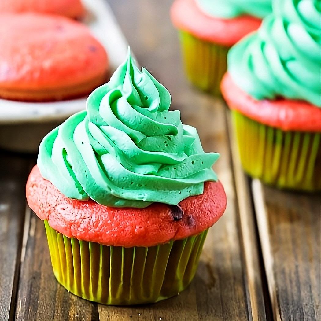 Watermelon Mojito cupcakes on a picnic table.