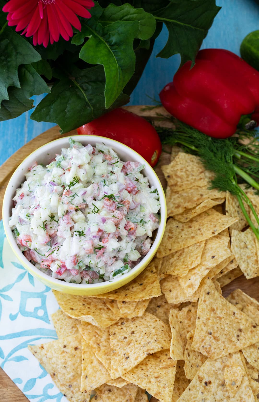 Creamy Cucumber Salsa in a bowl surrounded by tortilla chips.