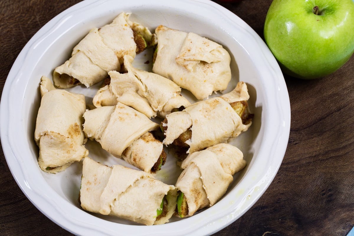 Unbaked dumplings in baking dish.
