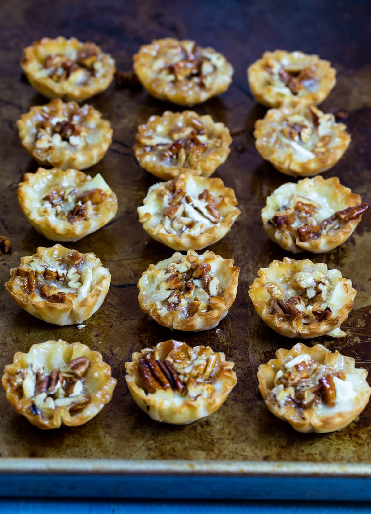 Bourbon Pecan Brie Bites on baking sheet.