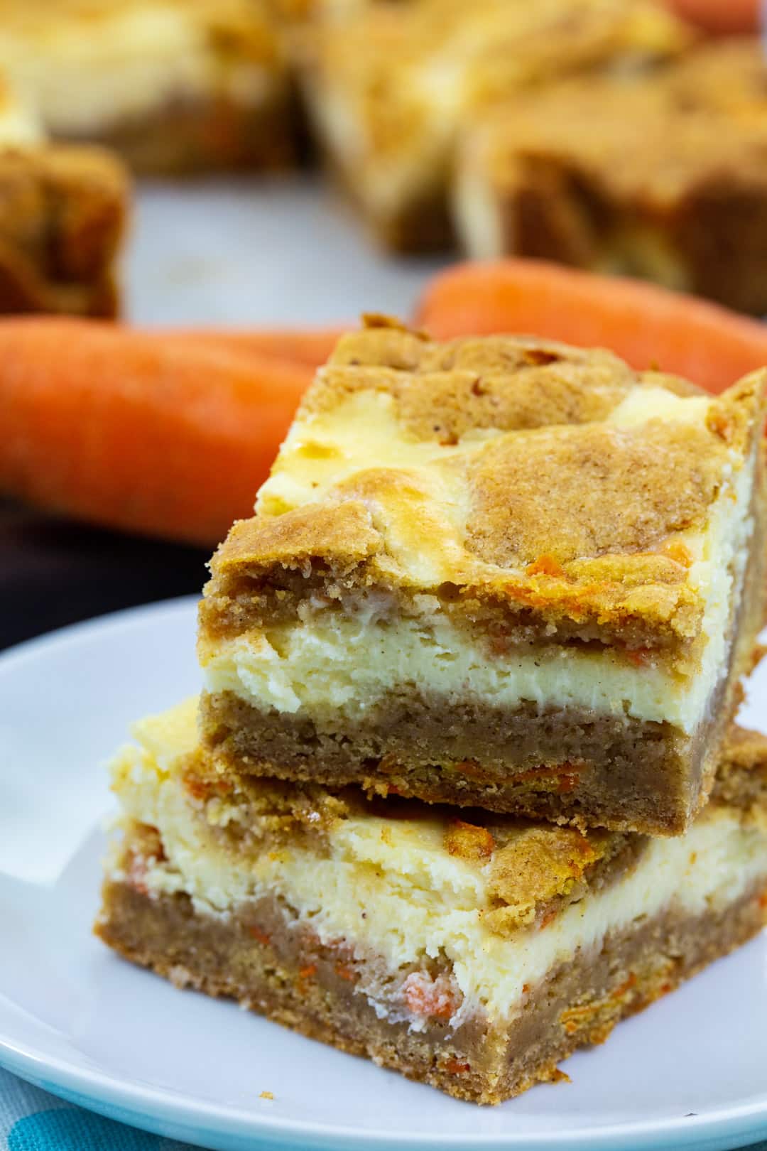 Two cheesecake bars stacked on top of each otherh