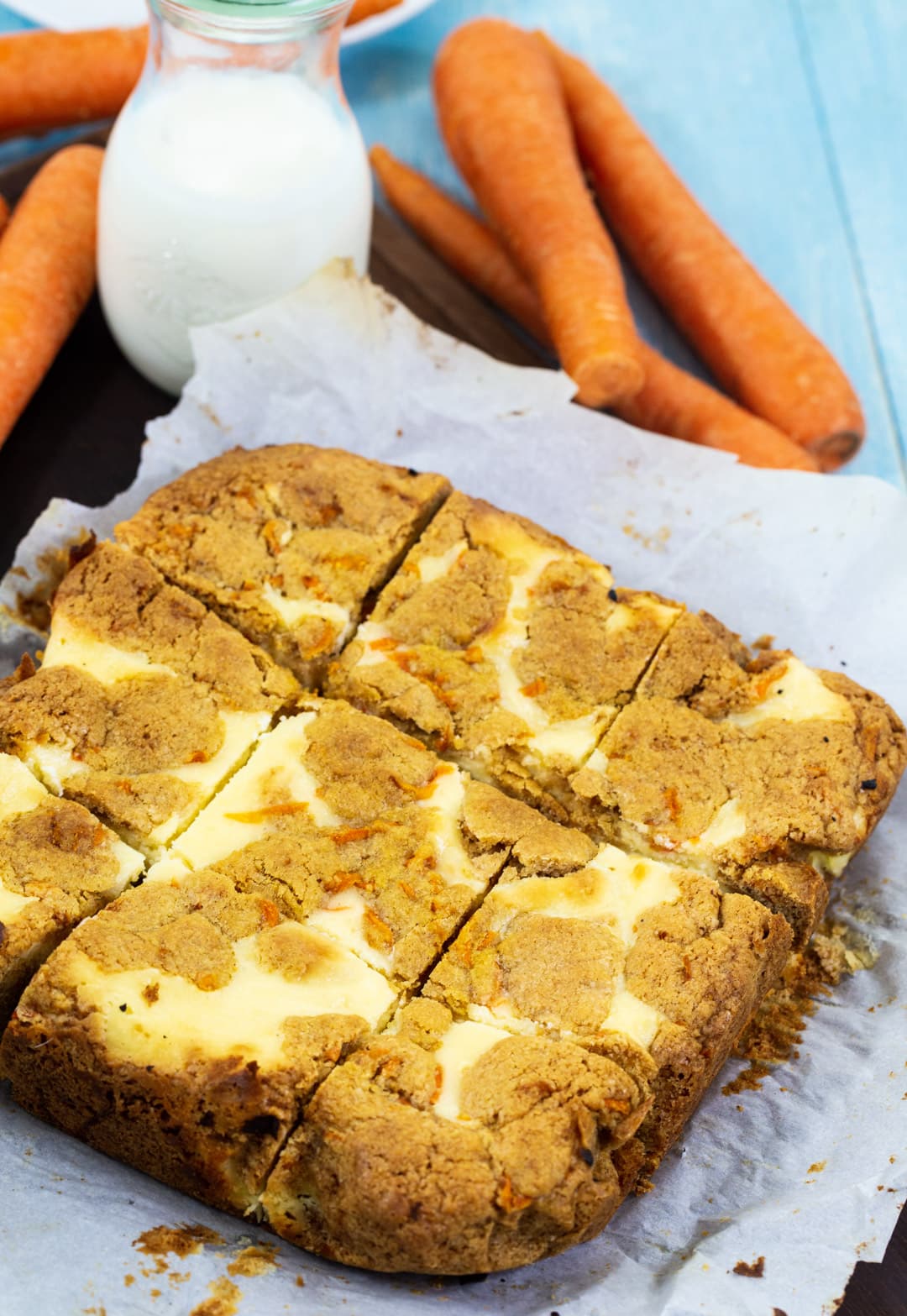 Carrot Cake Cheesecake Bars cut into squares.