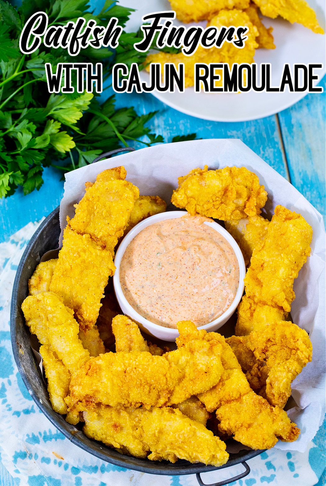 Fried Catfish Fingers in a basket with remoulade.