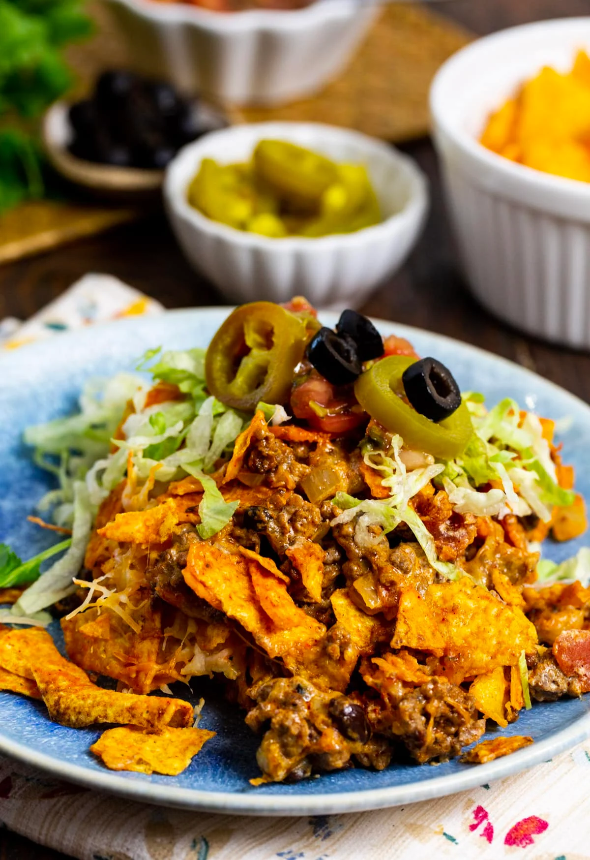 Ground Beef Doritos Casserole dished up on a plate.
