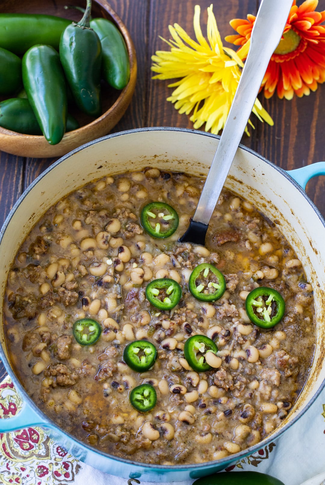 Spoon scooping up black-eyed peas.