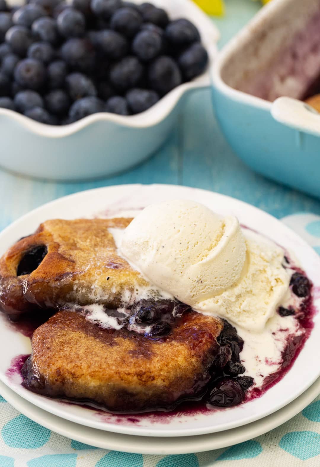 Blueberry Dumplings topped with ice cream.