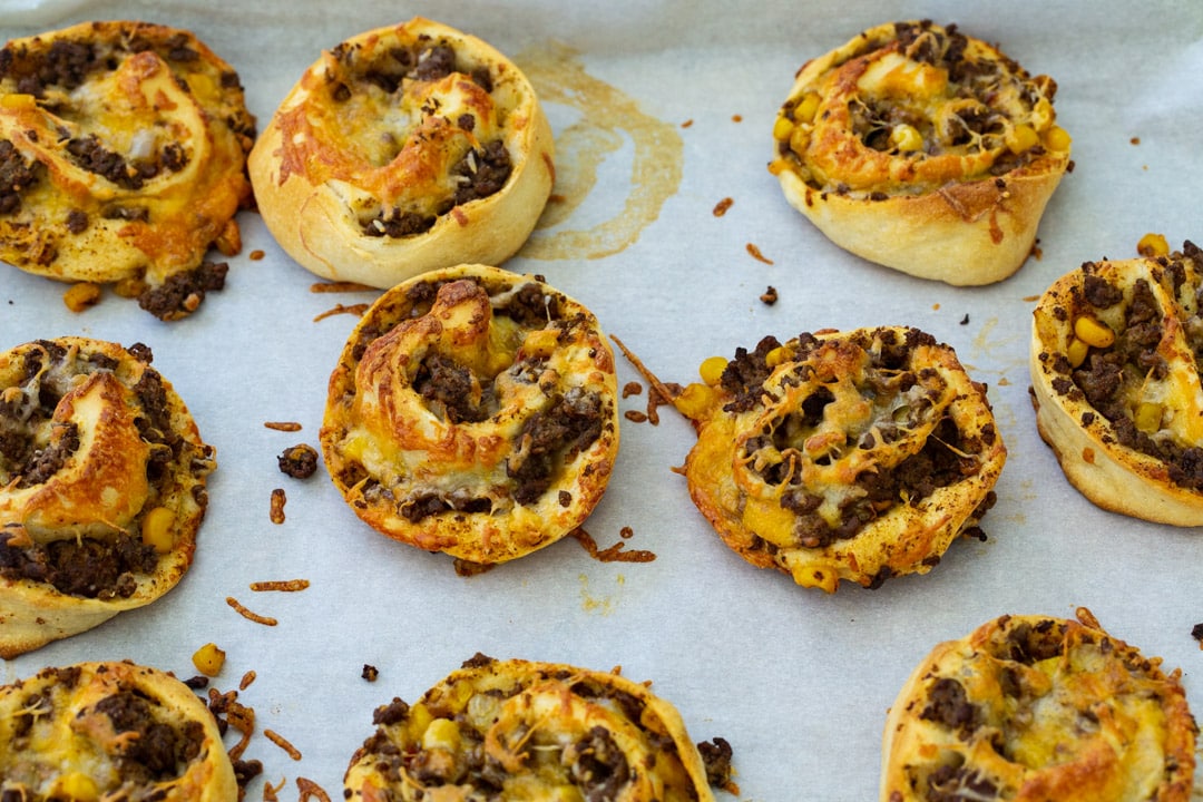 Taco Pizza Rolls on baking sheet.