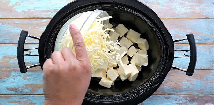 Cheese added to slow cooker.
