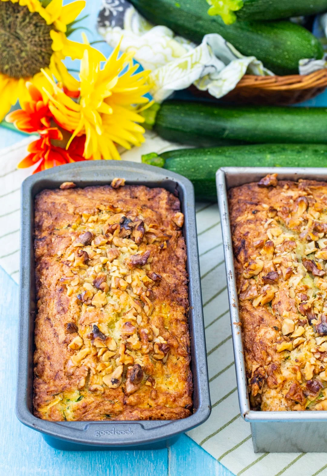 Two Loaves of zucchini bread in baking pans.