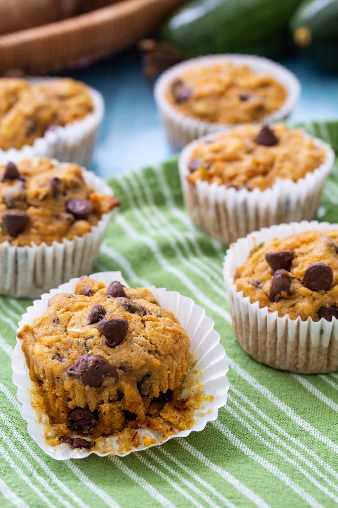 Sweet Potato Zucchini Muffins on a green and white tea towel.