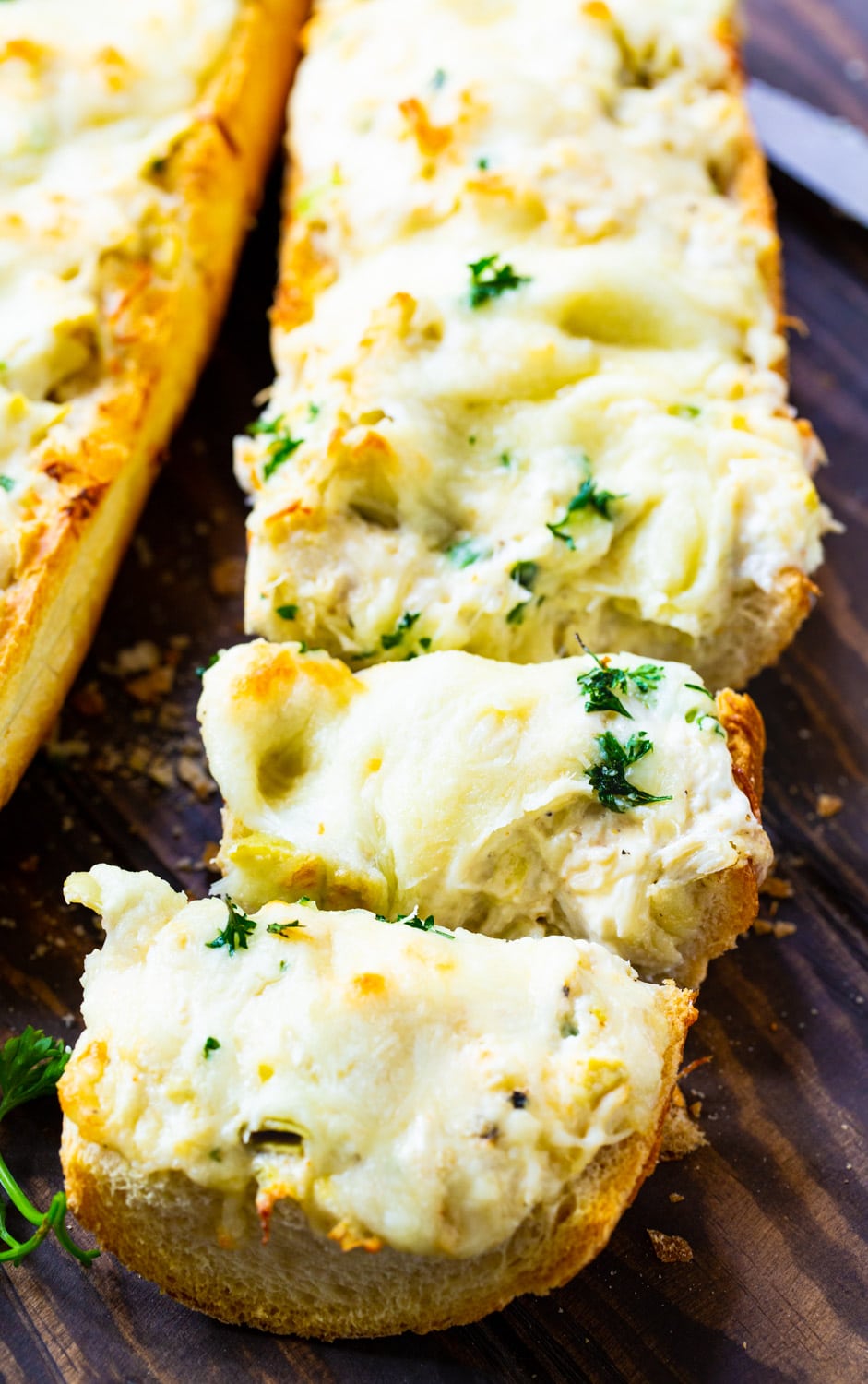 Artichoke and Crab Dip Bread cut into slices.