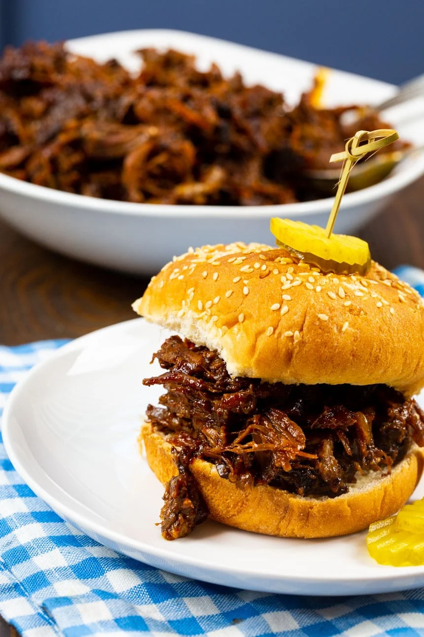 BBQ Beef Sandwich with bowl full of shredded beef.