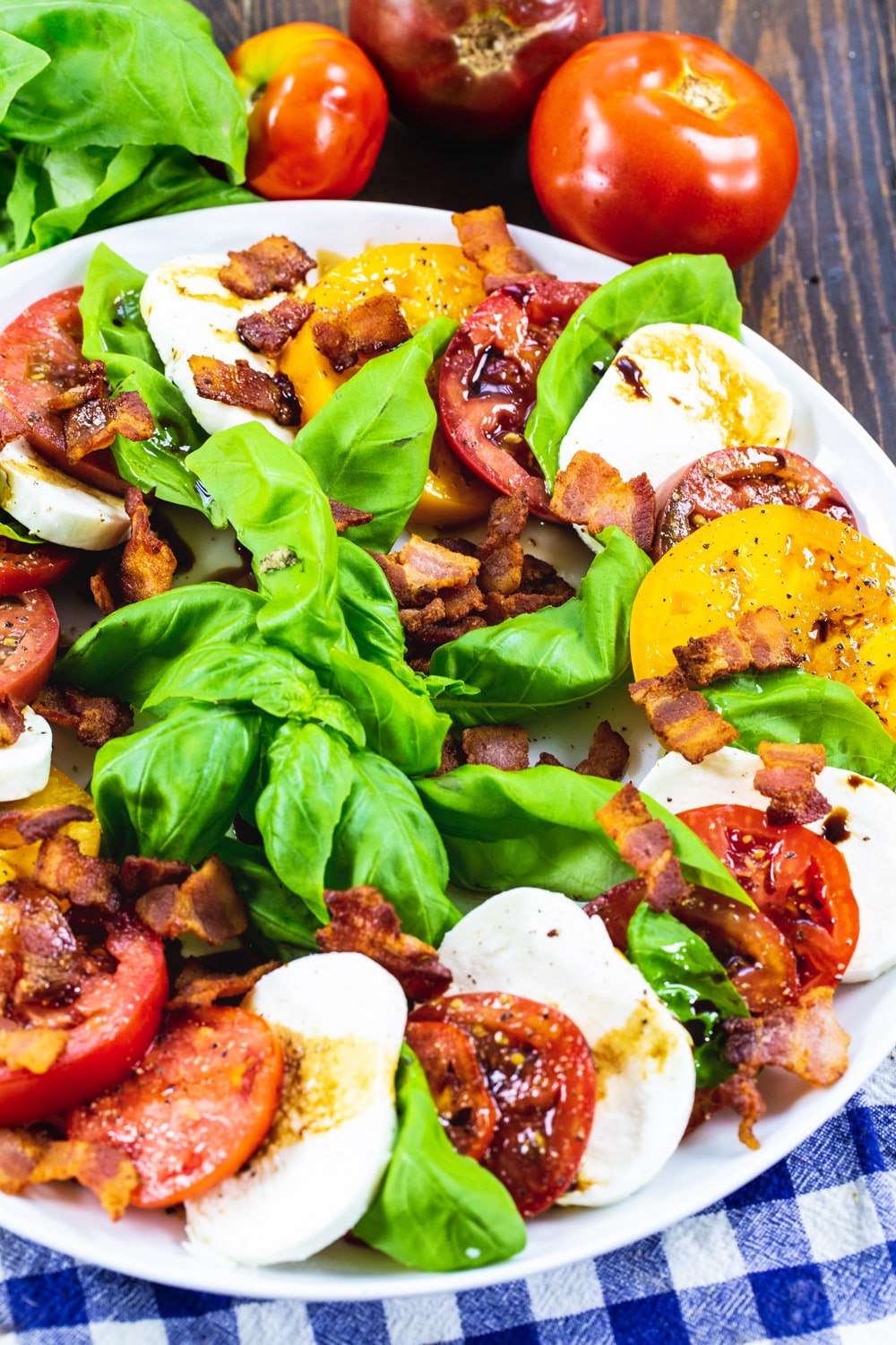 Bacon Caprese Salad on white serving plate.