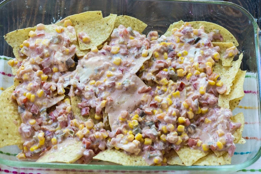 Add the sour cream and corn mixture to the baking dish.