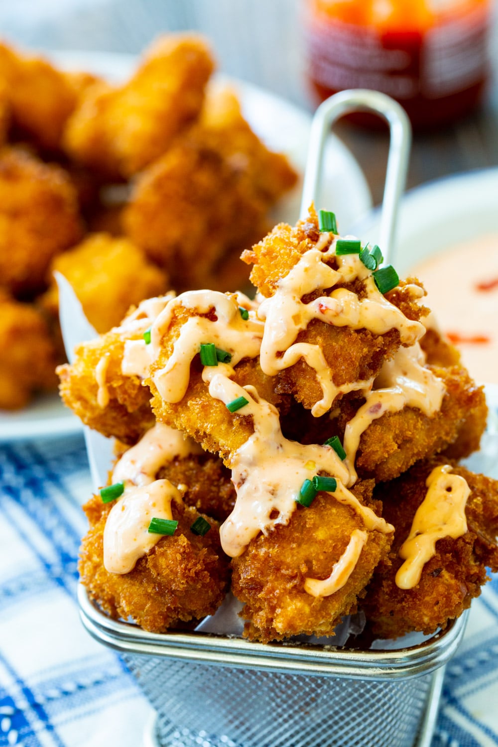 Bang Bang Chicken in a metal basket.