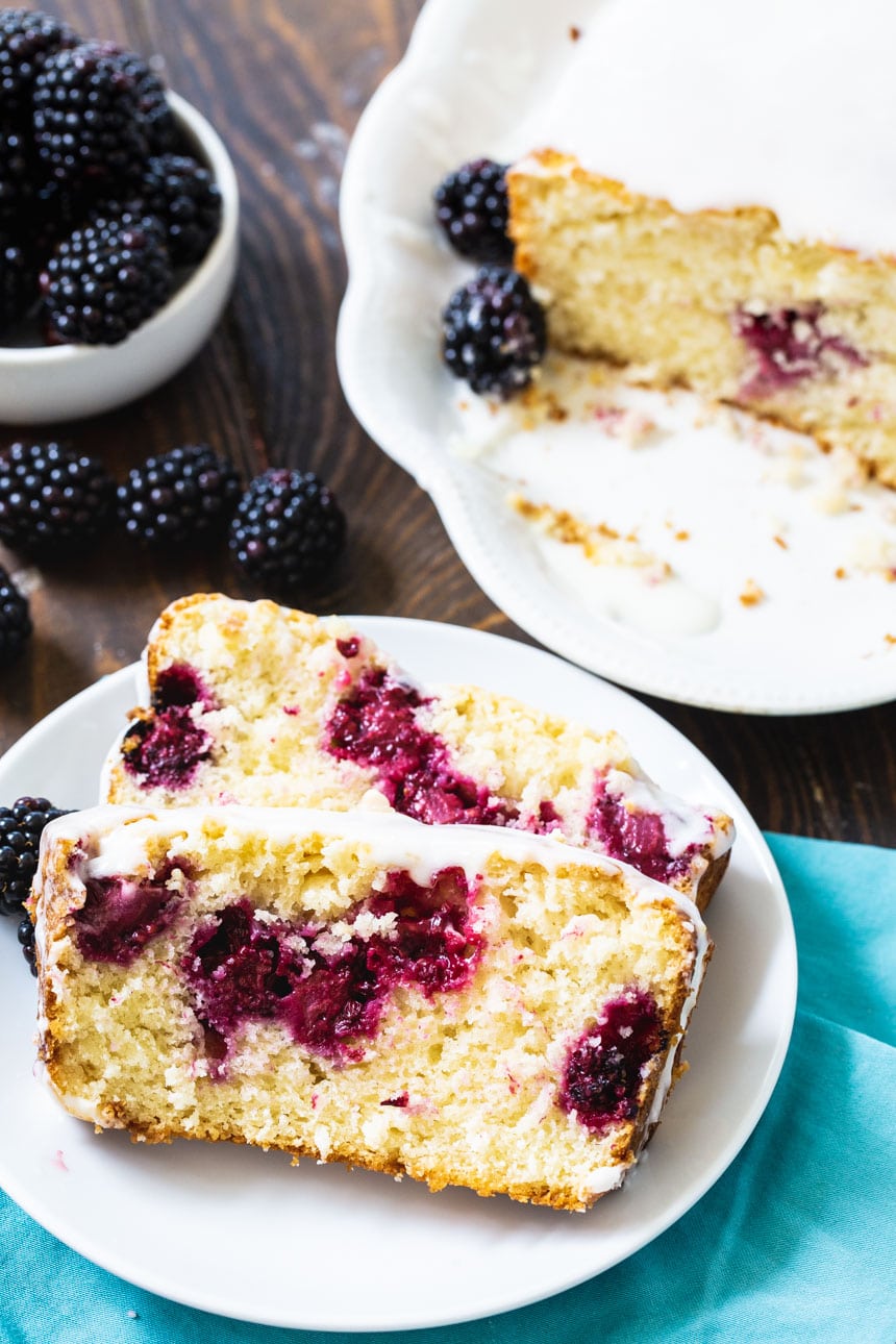 2 slices of Blackberry Buttermilk Loaf Cake on a plate