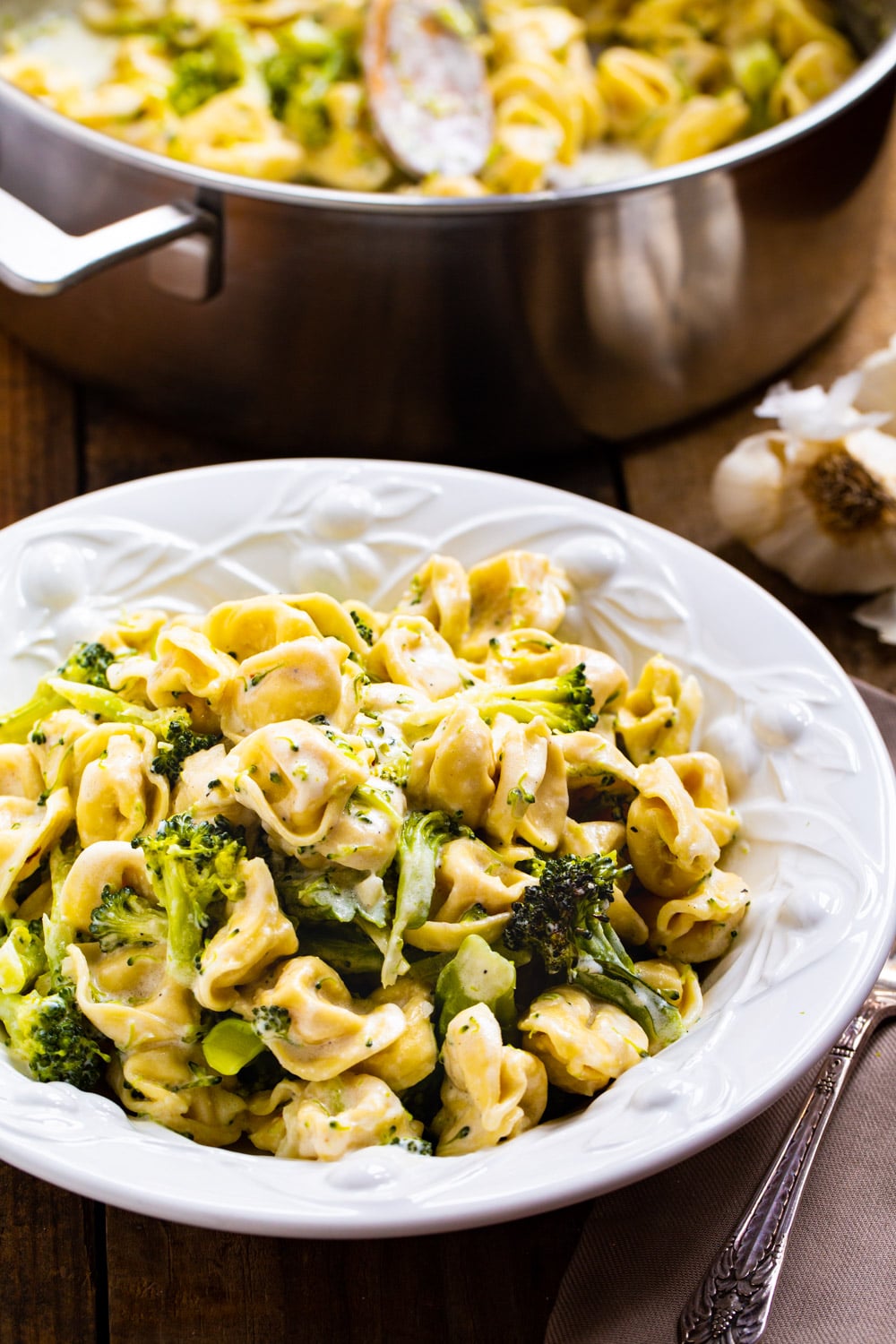 Broccoli Alfredo Tortellini dished up in a pasta bowl.