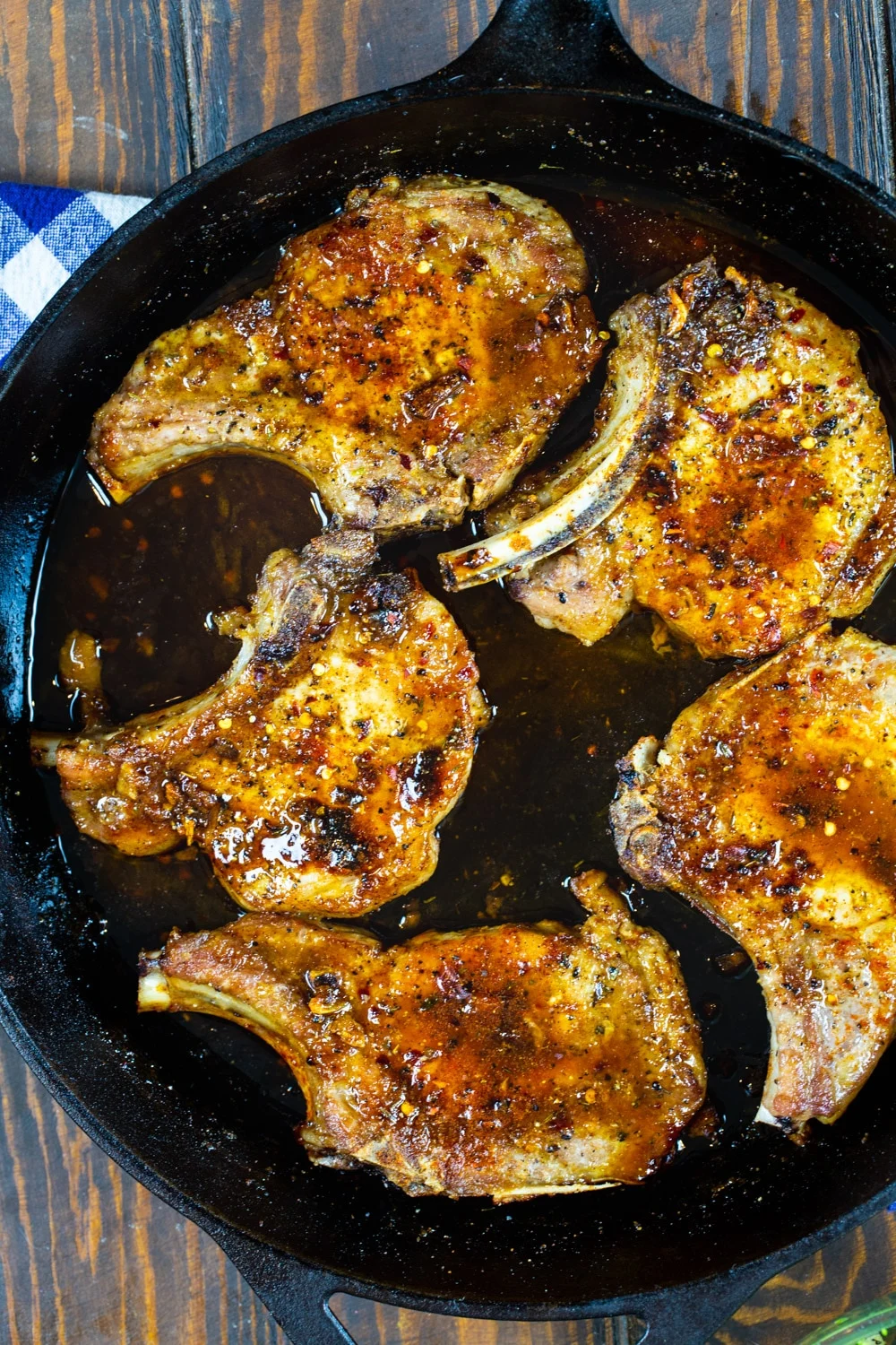 Brown Sugar Pork Chops in a cast iron pan.