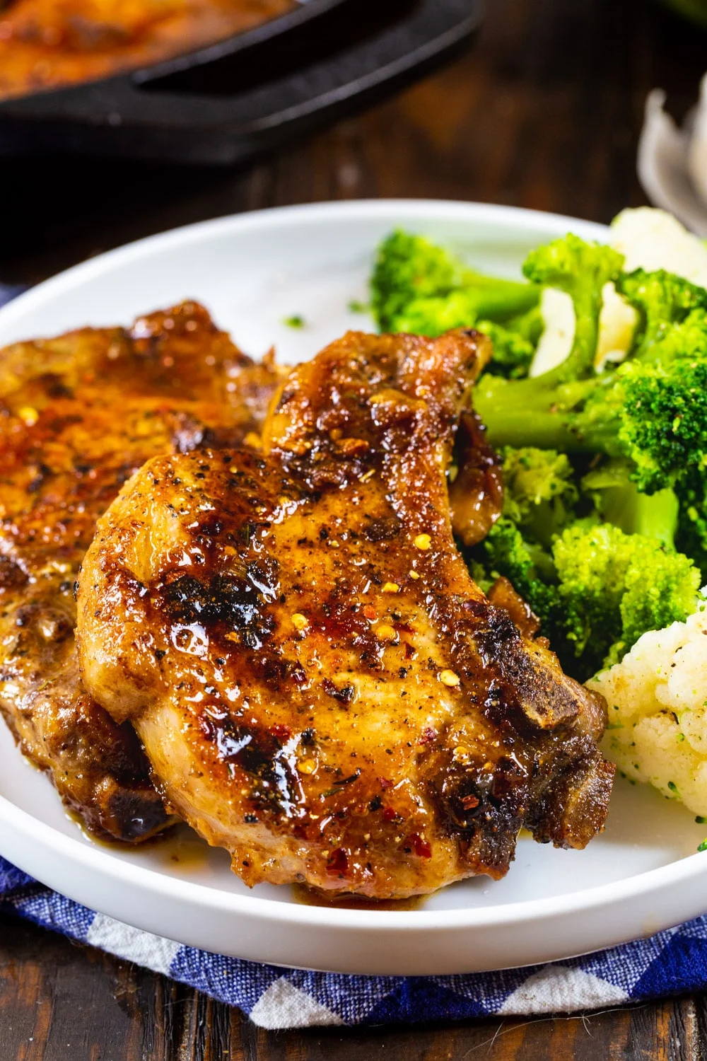 Brown Sugar Garlic Pork Chops on a plate with broccoli.