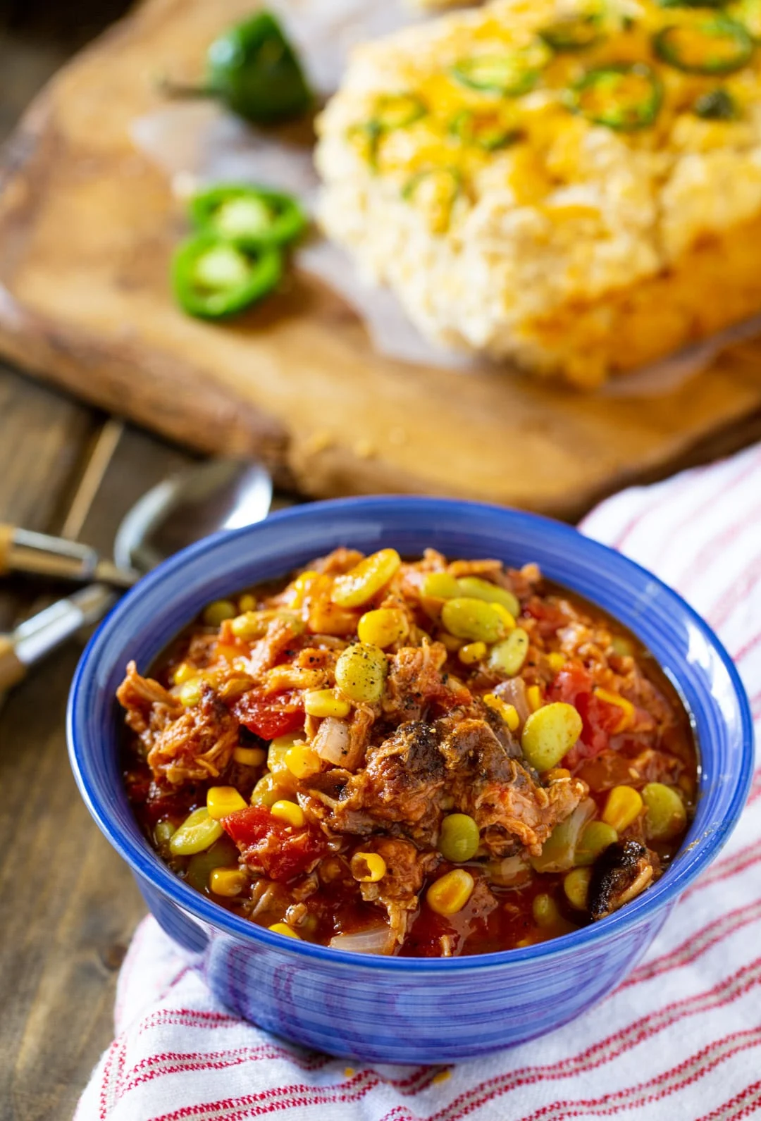 Stew in a bowl and loaf of beer bread.